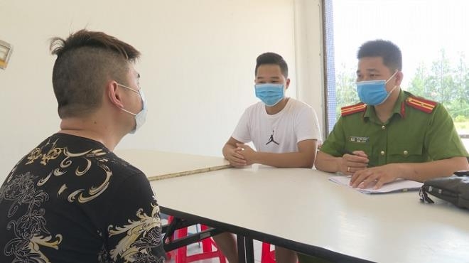 The police interogate some of the Chinese detainees for illegal acts in Vietnam