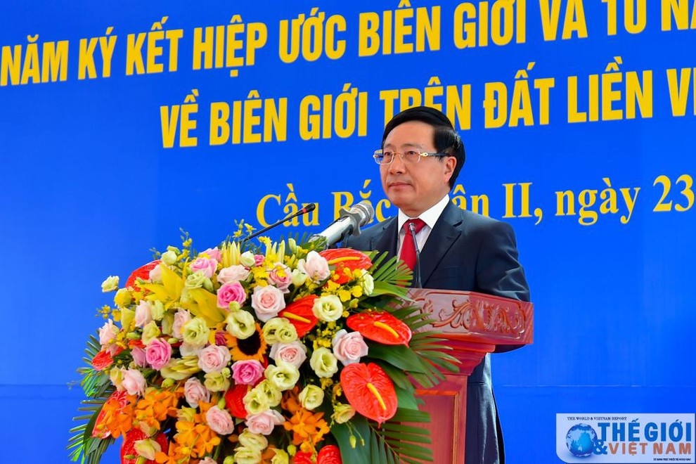 Deputy PM and FM Pham Binh Minh addresses delegates at the event that also marks 10 years of implementing three bilateral documents, namely a Protocol on Border Demarcation and Marker Planting, the Agreement on Border Management and the Agreement on Border Gates and Border Gate Management.