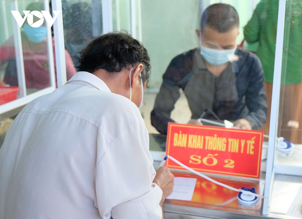 Desks which are used for people to make medical declarations are separated in an effort to curb the potential spread of the SARS-CoV-2 virus.