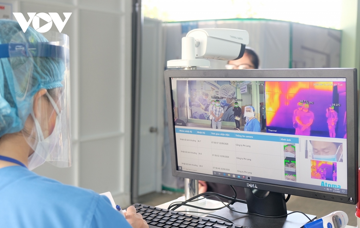 An automatic body temperature checker is installed in order to control the flow of people in and out of the hospital.