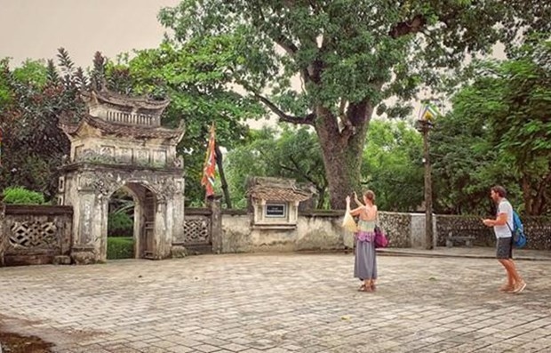 Foreign tourists visit a historical site in Vietnam