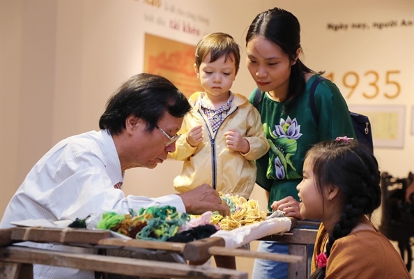 Artisan Nguyen Xuan Duc in Thuong Tin district of Hanoi displays his embroidery skill.