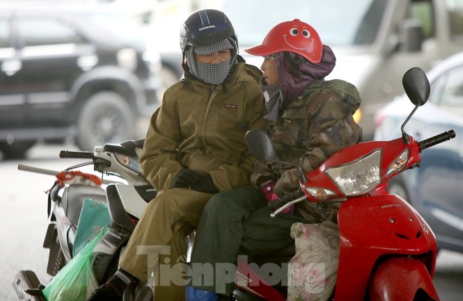 Some locals choose to wear raincoats as they battle against the cold air.