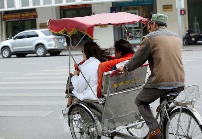The cold air, combined with strong winds, causes plenty of difficulties for local workers.