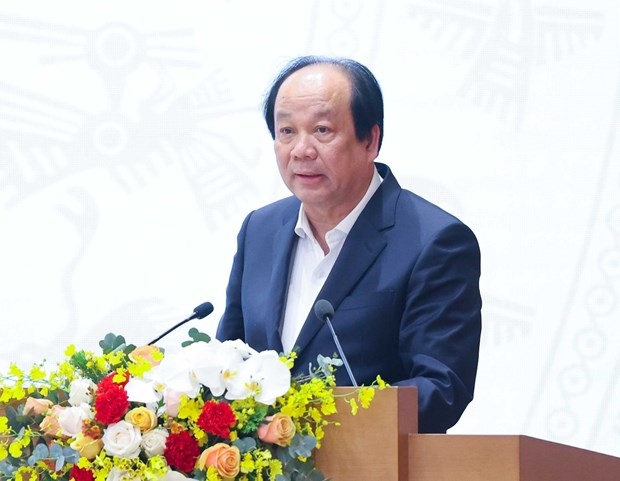 Minister and Chairman of the Government Office Mai Tien Dung speaks at the national teleconference between the Government and localities on December 28.