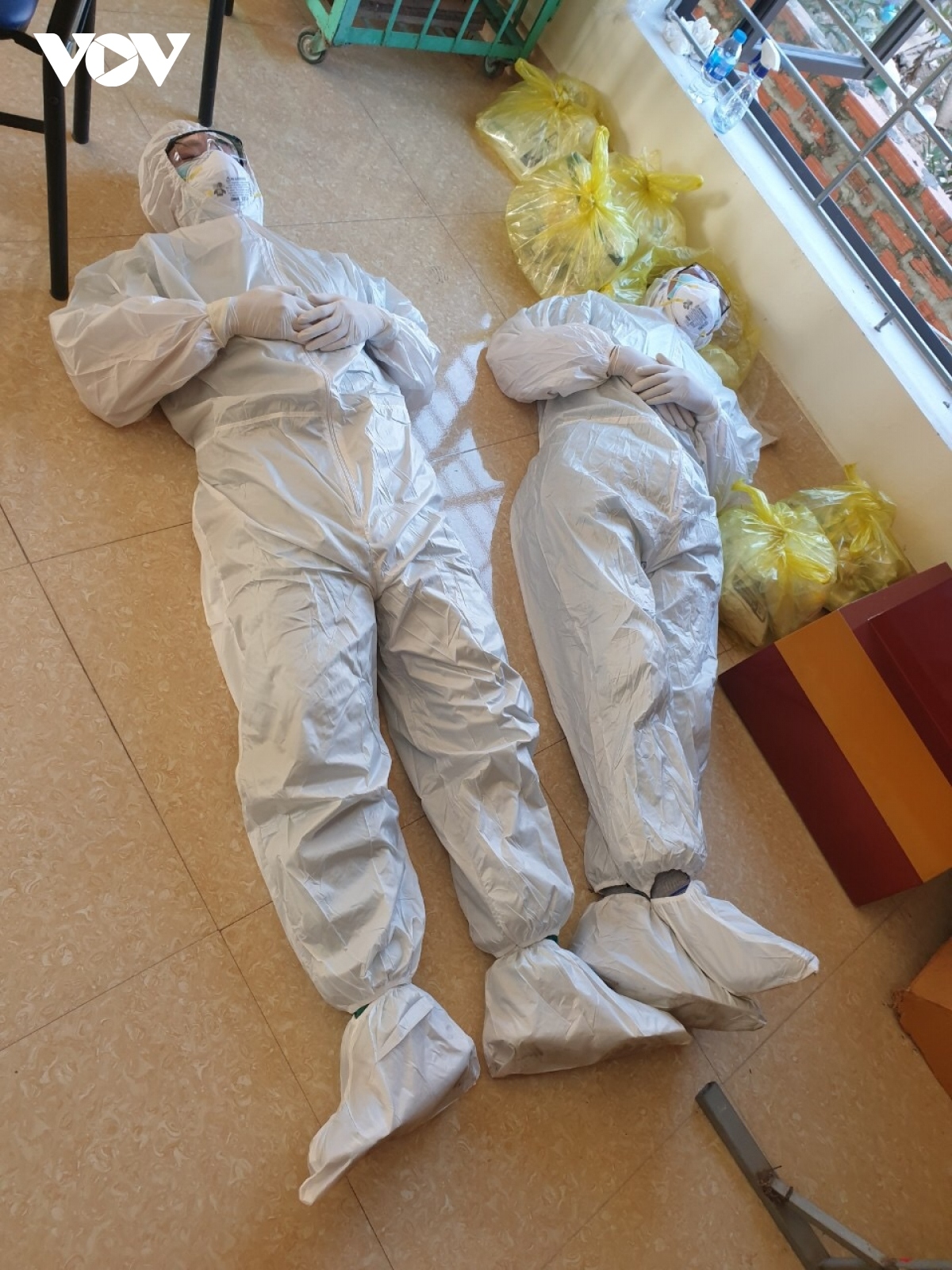 The fresh coronavirus outbreak requires them to work throughout day and night. Some take a short nap on the floor during the break