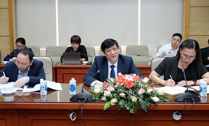 Minister of Health Nguyen Thanh Long speaks during a working session with Chinese, Indian and Russian ambassadors in Hanoi on March 31