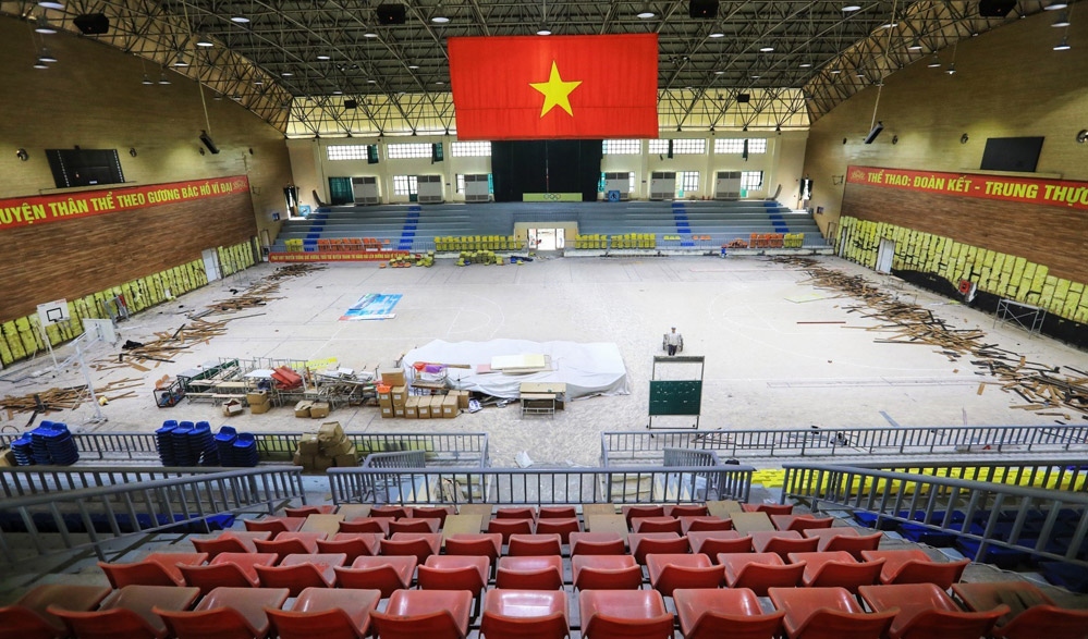 Workers renovate the Thanh Tri competition hall, the venue for basketball at the 31st SEA Games which will take place later this year.