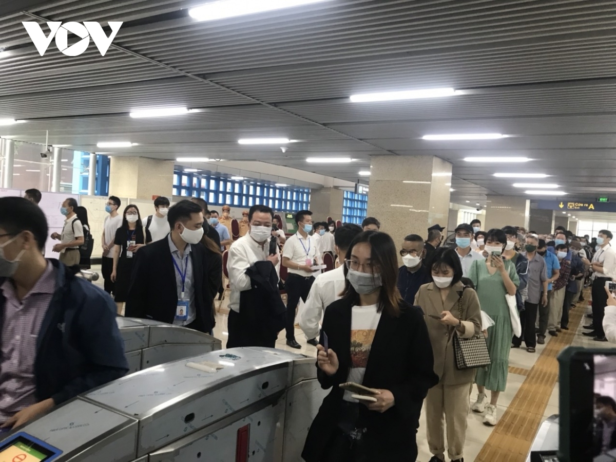 Local people quickly line up getting a free ticket to board the train