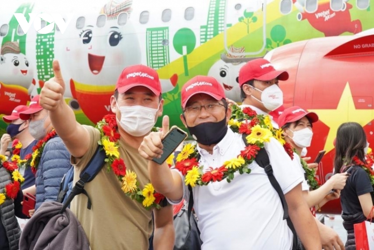 These visitors are happy upon their return to Vietnam after two years.