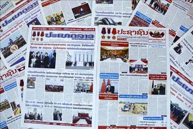 Major Lao newspapers give wide coverage on National Assembly Chairman Xaysomphone Phomvihane’s current visit to Vietnam. (Photo: VNA)