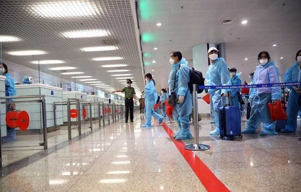 Passengers wait to handle procedures at Noi Bai International Airport in Hanoi