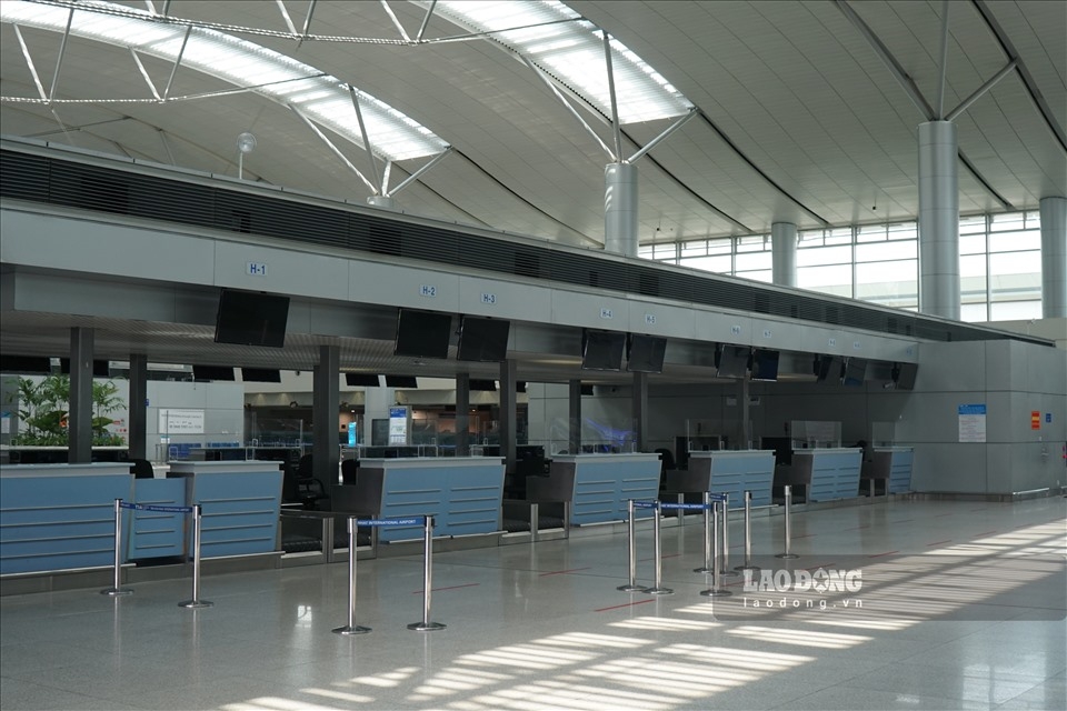 The check-in counters at the airport have yet to return to full capacity.