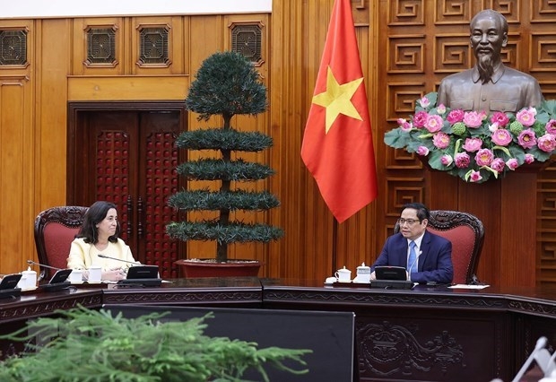Prime Minister Pham Minh Chinh (R) meets with WB Regional Vice President for East Asia and Pacific Manuela V. Ferro in Hanoi on March 21. (Photo: VNA)