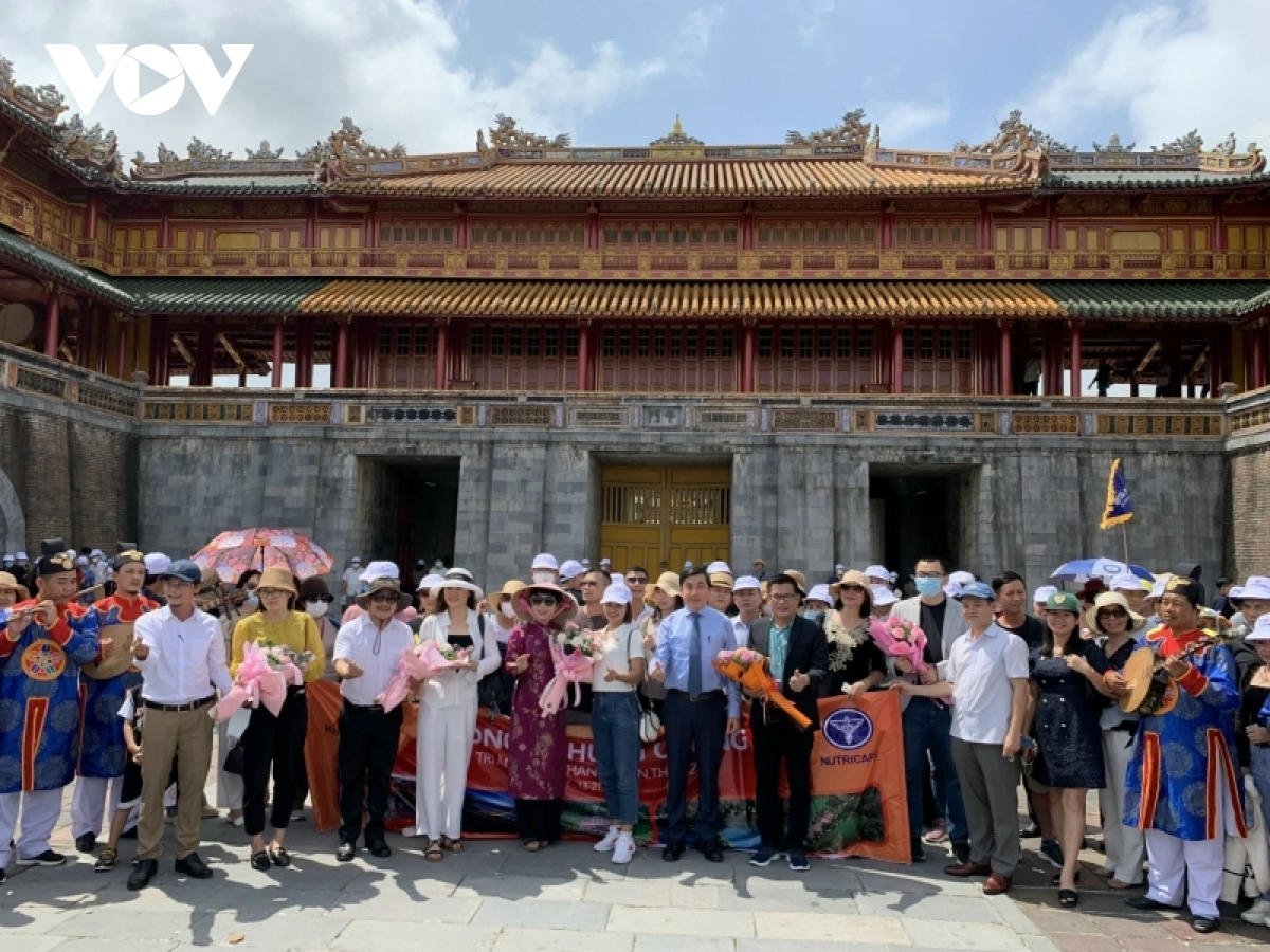 MICE tourists pose for a photo at the Hue imperial citadel.