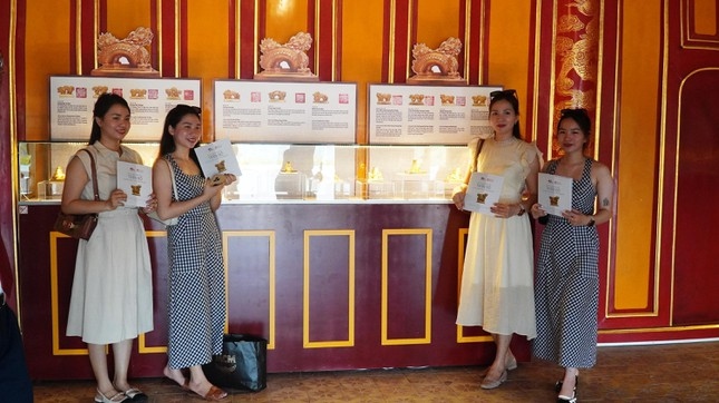 Many visitors are excited at posing for photos alongside historical items.