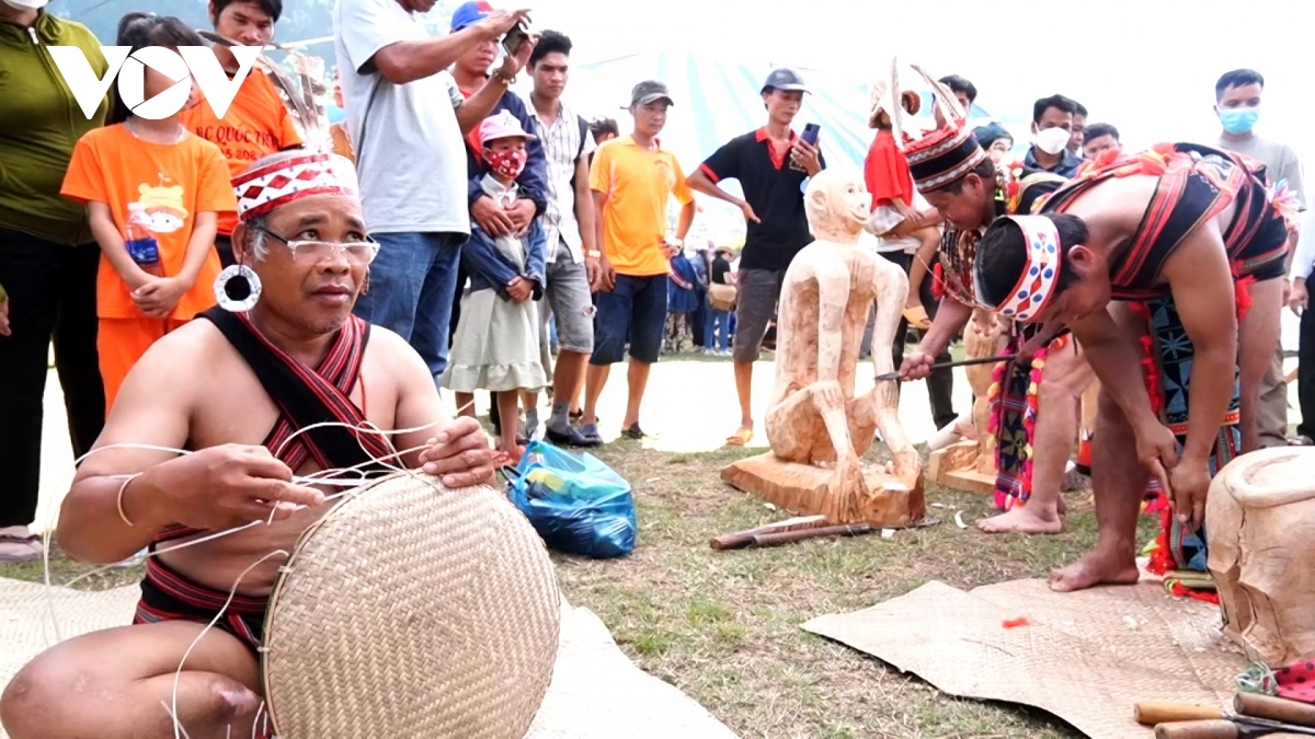 Ethnic artists performs folk wood sculpting