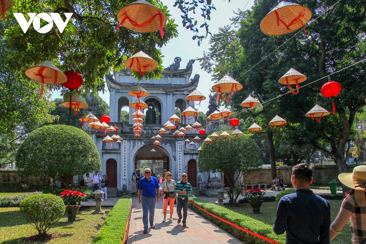 Foreign holidaymakers visit  the Temple of Literature in Hanoi 