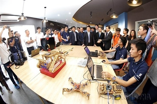 Officials visit the IoT (Internet of Things) Innovation Hub at Hoa Lac Hi-tech Park in Hanoi.