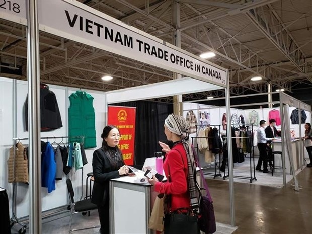 Tran Thu Quynh, Commercial Counsellor and head of Vietnam’s trade office in Canada, talks to a visitor to Apparel Textile Sourcing Canada.