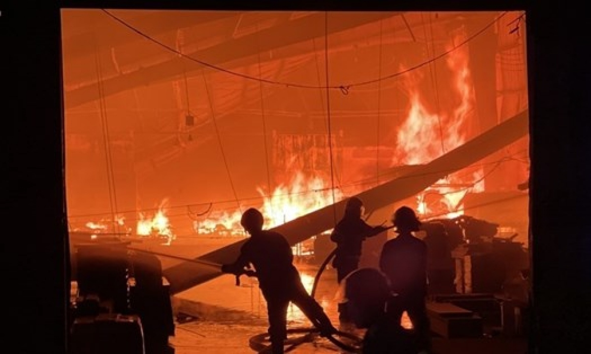 Three workers pass away and one is injured while cleaning up embers of a fire at the Scancom Vietnam company located in the Song Than 1 industrial park in Di An city of Binh Duong province on June 17.