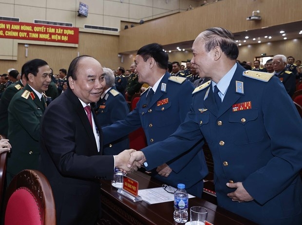 President Nguyen Xuan Phuc meets delegates at the event (Photo: VNA)