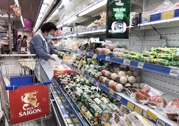 Customers buy food at a supermarket in HCM City. (Photo: VNA)