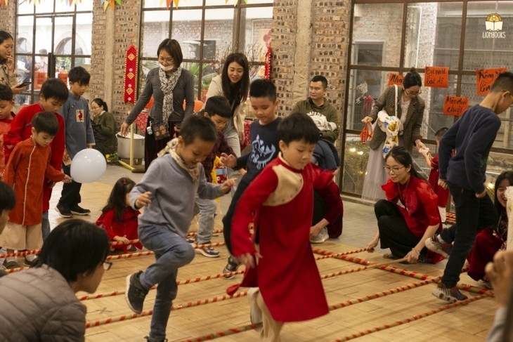 Children participate in the bamboo dance.