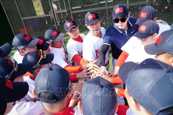 Vietnamese players compete in first international baseball tournament in Laos. (Photo: VNA)