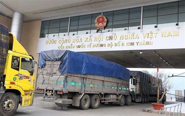 Trucks carrying products for export to China pass through Kim Thanh International Land Border Gate No. 2 in the northern province of Lao Cai.