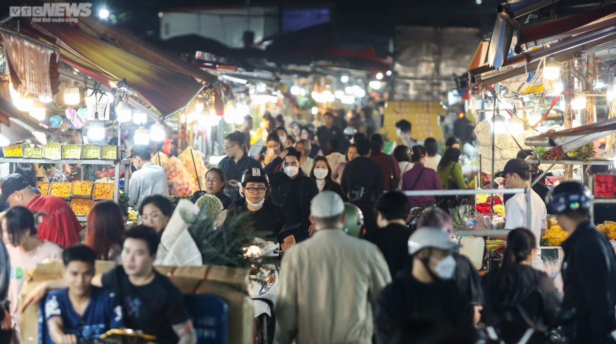 The flower market is busy with both sellers and buyers heading to the site several nights before Valentine’s Day.