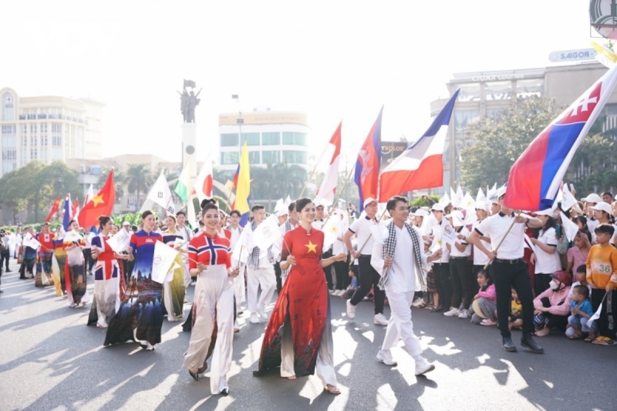 National flags of countries participating in the eighth Buon Ma Thuot Coffee Festival flutter amid the street festival.