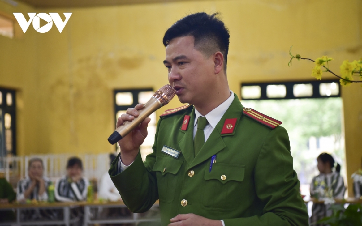 An officer sings a song as a gift to female prisoners during the special celebration.