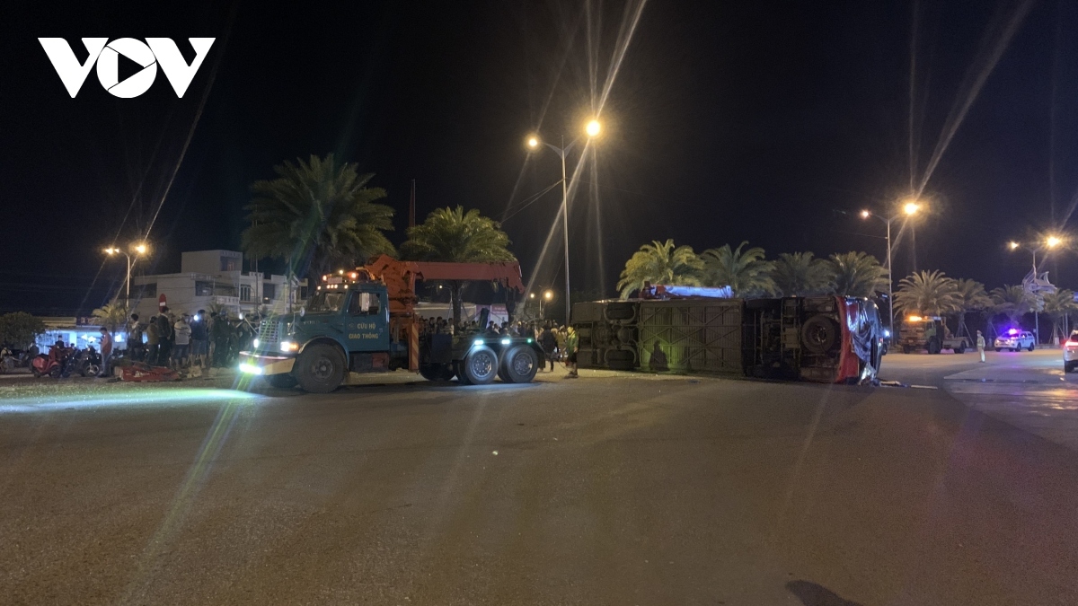 The coach was has been overturned on the road.