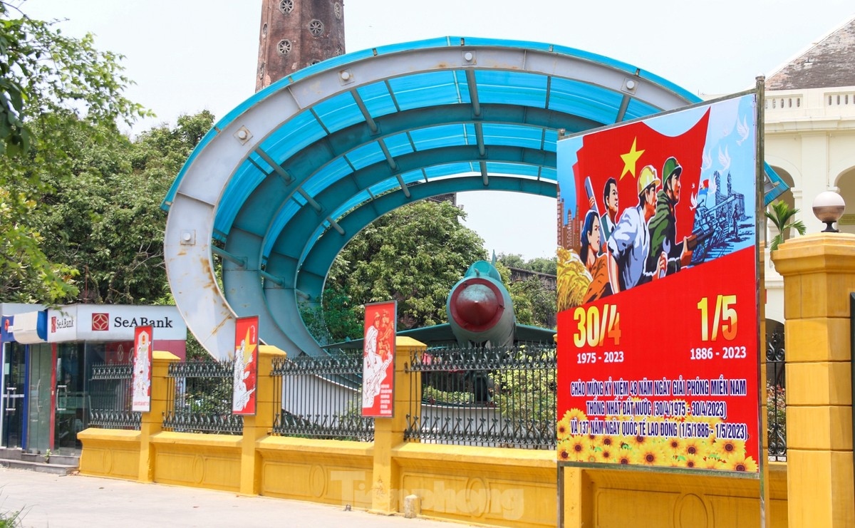 The gate of the Vietnam National Museum of History is adorned with an array of posters aimed at celebrating National Reunification Day.