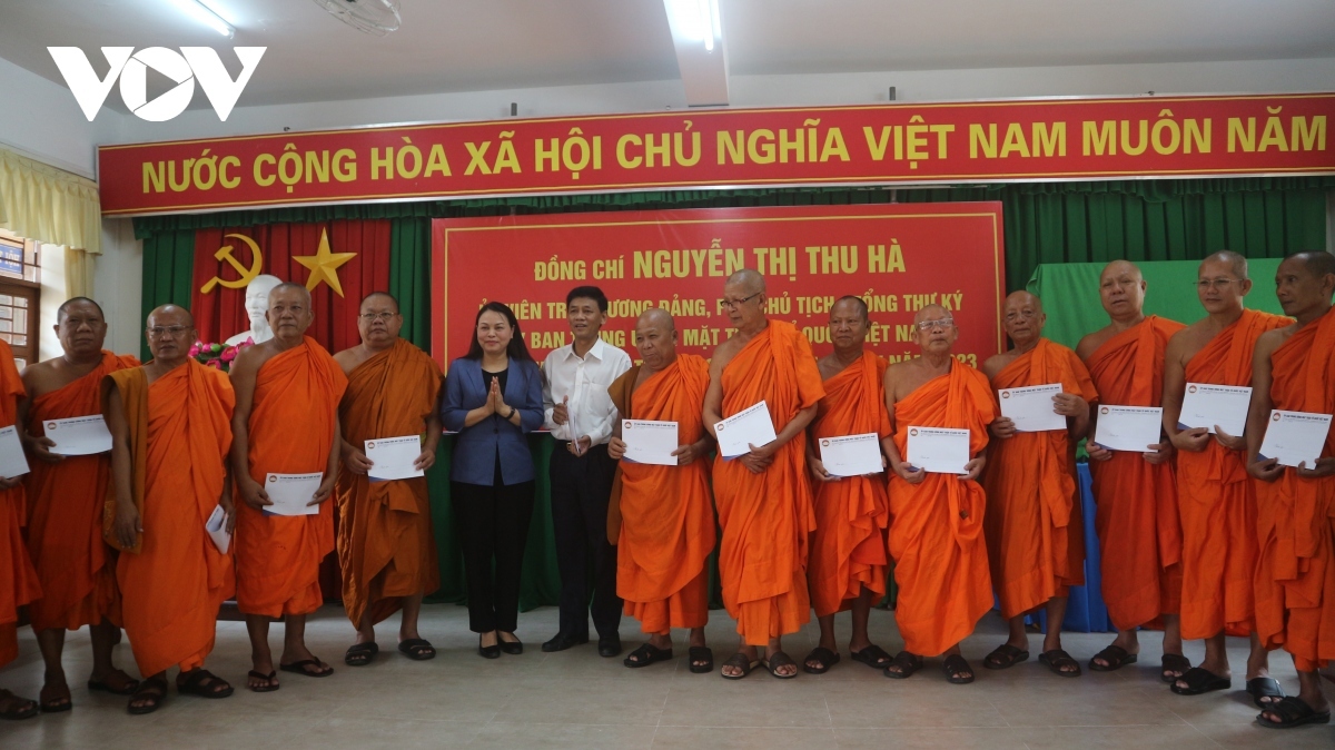 Leaders present gifts to monks as part of the occasion.