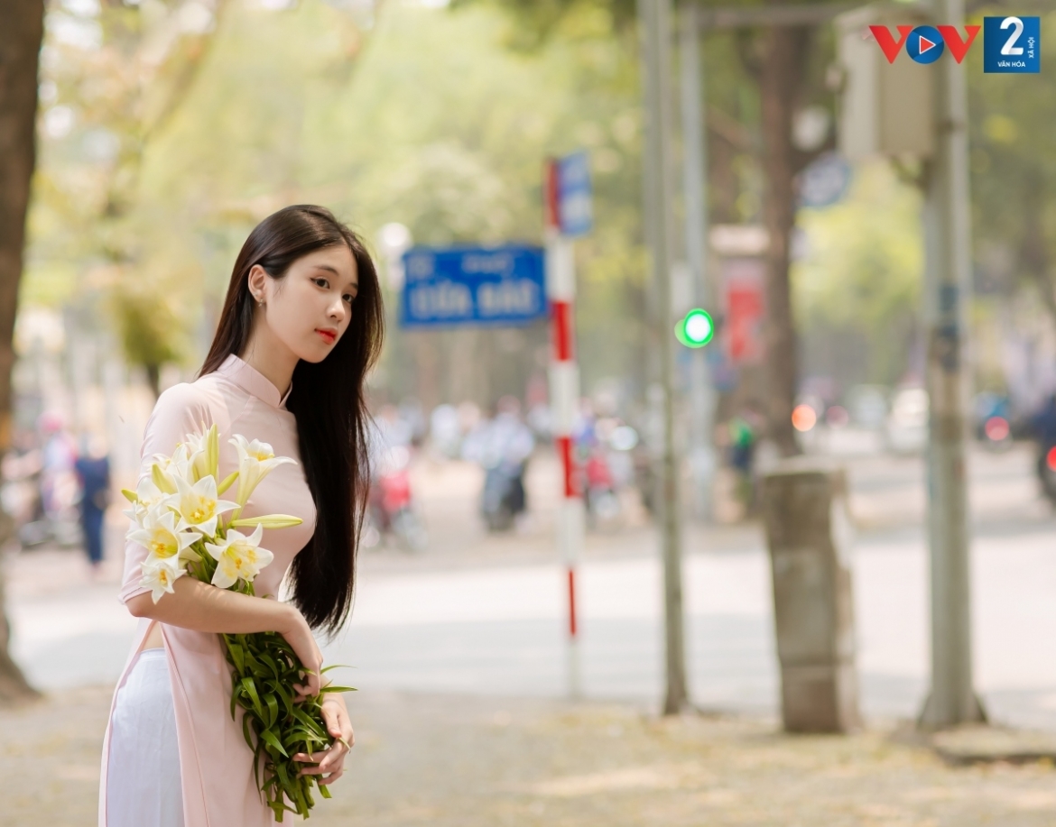 Many don an Ao Dai as they pose with the beautiful flowers.