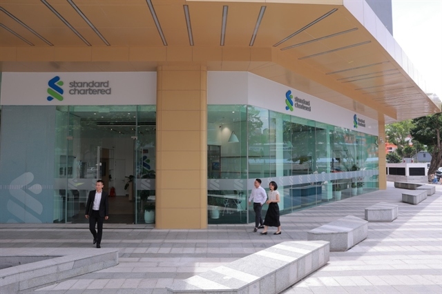 Standard Chartered Bank's headquarter in Hanoi. The bank forecasts the State Bank of Vietnam will make another 50bps cut in the refinancing rate to 5% by the end of the second quarter. Photo courtesy of the bank