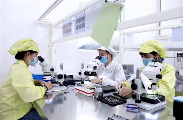 Electronic components produced at Youngbag Vietnam in Vinh Phuc Province. The electronics industry of Vietnam has a great opportunity to participate in the global supply chain amid a production shift. — VNA/VNS Photo Hoang Hung