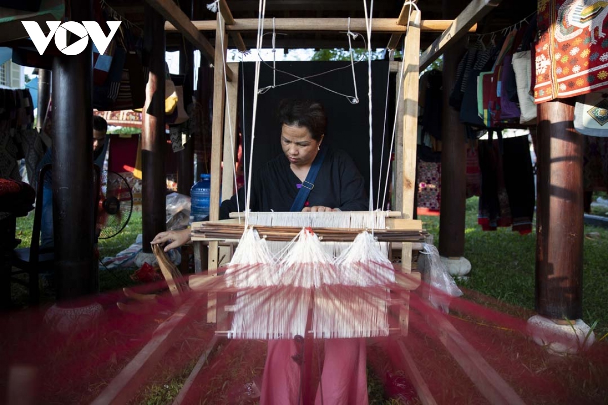 A craftswoman shows off her skills during the festival.