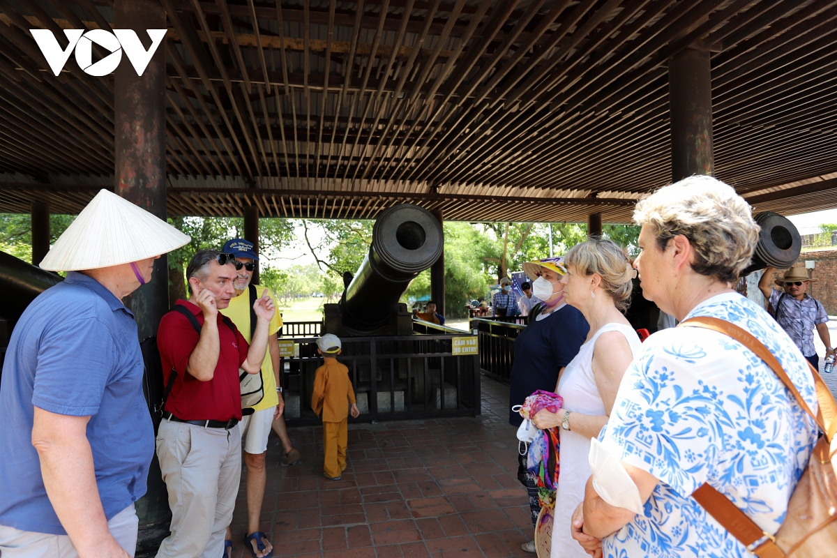 A group of foreign holidaymakers visit a historical vestige in Hue - the former imperial city of Vietnam.