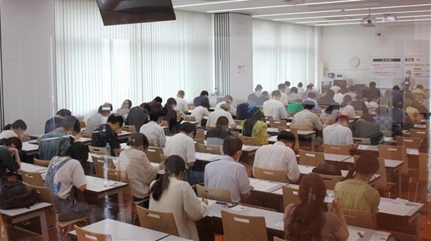 Candidates take part in the Vietnamese-language proficiency test on June 18.