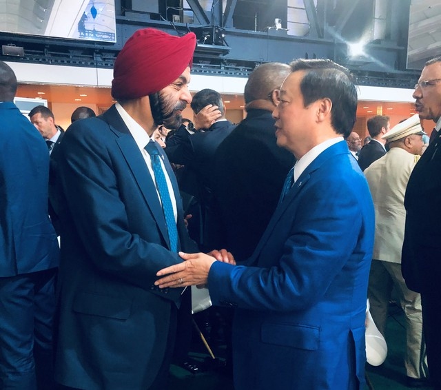 Deputy Prime Minister Tran Hong Ha (R) meets with World Babk President Ajay Banga in Paris, France, on the sidelines of an international conference on a New Global Financial Pact summit.