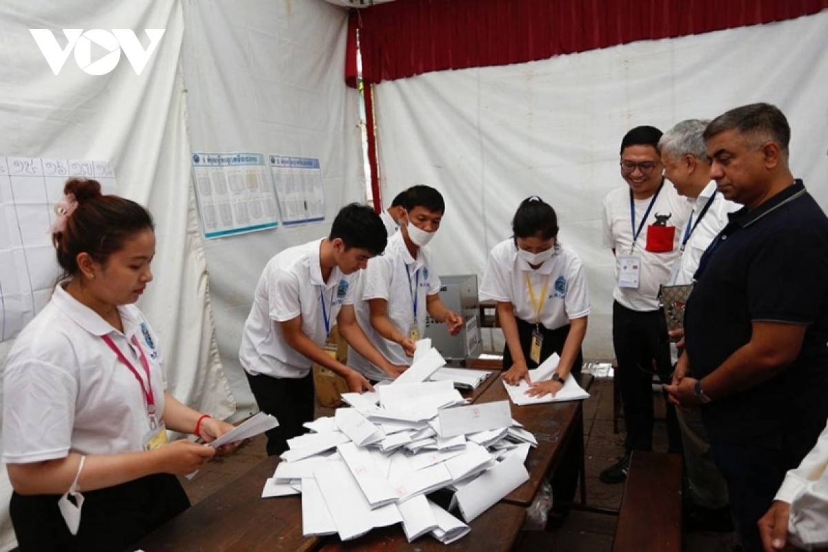 International observers witness the counting of ballots in the Cambodian general election 2023.