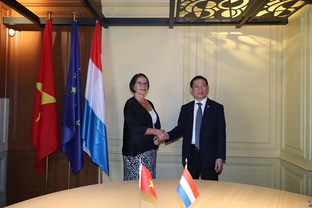 Finance Minister Ho Duc Phoc (R) and Luxembourg Finance Minister Yuriko Backes at a meeting on July 7
