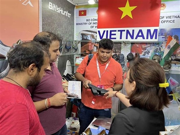 Visitors explore Vietnamese footwear products at the IIFF