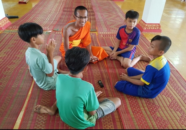 The monks and students at Prey Chop pagoda chat during a break