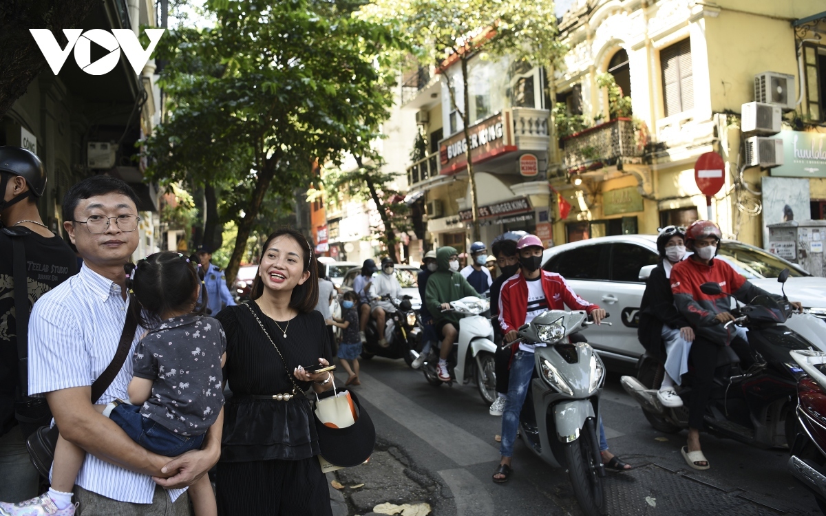 The area around Hanoi Cathedral is seen bustling with people.