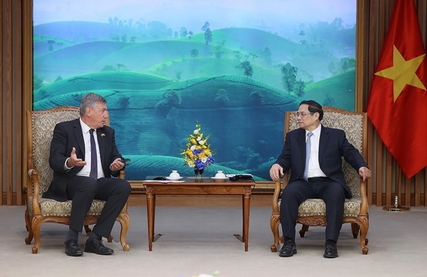 Vietnamese Prime Minister Pham Minh Chinh (R) and Minister-President Jan Jambon of Belgium's Flanders region at the meeting in Hanoi on September 12.