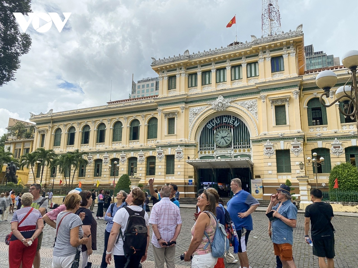 International tourists visit Saigon Central Post Office in Ho Chi Minh City 